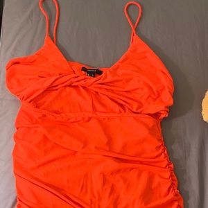 A mini neon orange summer dress.